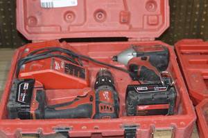 Milwaukee hammer drill and impact Drill with charger and 2 M18 batteries