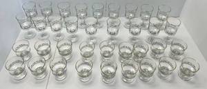 lot 32 image: 36 Pcs. Of Vintage Christmas Glasses (Gold Worn On Edges Of Some)