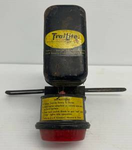 lot 99 image: Antique 1957 Trailite Battery Operated Clamp On Rear Bike Light With License Holder -
