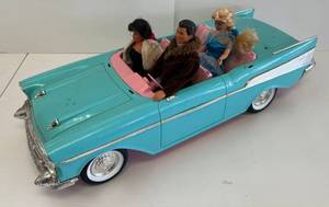 lot 112 image: 1988 Barbie Car (Missing Parts) And Three Barbie Dolls -