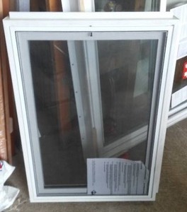 lot 734 image: Vinyl Basement Hopper Window.