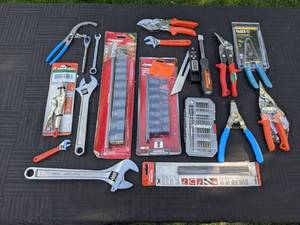 lot 101 image: Large Assortment of Tools Straight Jaw Pliers, Wrenches, Rasp and Chisel, Impact Sockets and More