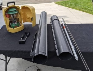 lot 210 image: Coleman Lantern with Yellow Carrying Case, 50 Drill Bits, Bazuka Fishing Rod Tube
