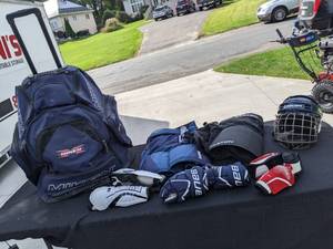 lot 219 image: Hockey Gear - Miken Gear Bag, Reebok Leg Pads, Bauer Gloves, CCM Elbow Pads, Bauer Helmet, Easton Pants (Jr Small), Reebok Pants (Medium)