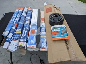 lot 197 image: Door Insulation Supplies Various Sizes of Frost King Door SweepDraft Stop Kits, Door Thresholds, and More