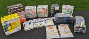 lot 131 image: 3M E-A-R Caps Hearing Protectors, 3M Cool Flow Respirator, HyFlex Ansell Gloves, and Boxes of 3M, Body Guard and Howard Leight by Honeywell Ear Plugs
