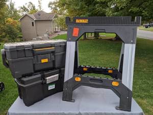 lot 130 image: DEWALT Adjustable Metal Legs Sawhorse and (2) DEWALT Tool Storage Boxes
