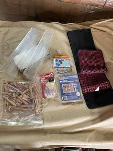lot 56 image: NEW. Fruitshooti Go Go Camera, New Fabric Repair Kit, Light Holder, Clothes Pins, Container, Back Brace