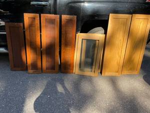 lot 114 image: 2-Oak Doors 42x14,  4-Wood Cabinet Doors 28x16 W, 2-Cherry PanelsDoors 39x9 W, 1-Chery PanelDoor 39x11.5 W, 1-Panel 33x11 W