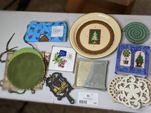 lot 132 image: All The Trivets Youll Ever Need & More- Vintage Cast Iron, Ceramic, Fabric & More