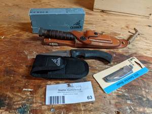 lot 63 image: Gerber Knife NEW in Box, Custom Knife in Leather Holster & Buck Blade NEW in Package