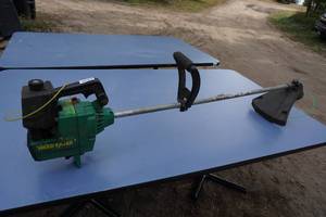lot 134 image: Weed Eater SST 45 Gas String Trimmer