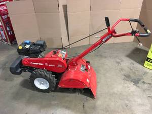 Troy-Bilt Mustang 18 in. 208 cc Gas OHV Engine Rear Tine Garden Tiller with Forward and Counter Rotating Tilling OptionsCustomer Returns See Terms on Auction