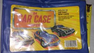 lot 432 image: Vintage 24 Car Matchbox, Hot wheels Case. Includes (6) Cars Including Tootsie Cars.