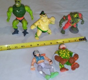 lot 437 image: TMNT Teenage Mutant Ninja Turtles and He Man (5) Action Figures.