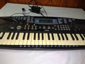 lot 381 image: Portable Electronics Keyboard.