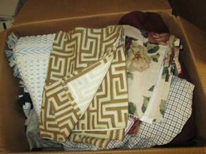 lot 415 image: box of couch pouches, blankets, pur...