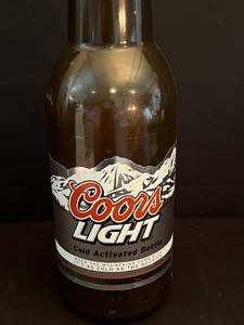 lot 84 image: Plastic Coors Bank Bottle