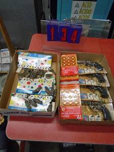Misc cap guns & key chains. As shown.