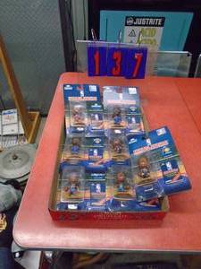 Assortment of headliner basketball figurines. As shown.