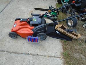 Black & Decker 36 volt cordless mower with battery, charger & bag. Looks nearly new. As shown.