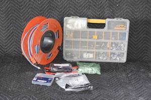 lot 93 image: bin organizer with various parts extension cord and more