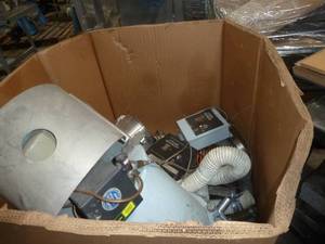 lot 34 image: Gaylord box full of volumetric feeder pieces and hose