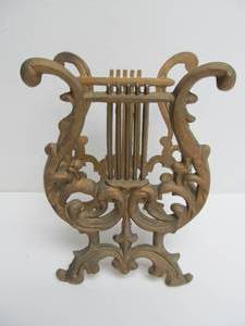 lot 150 image: Vintage Cast Iron Musical Magazine Rack