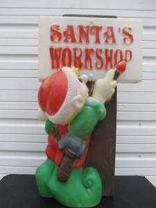 lot 225 image: Vintage Santas Workshop Sign wElf Christmas Blowmold Lawn Decoration