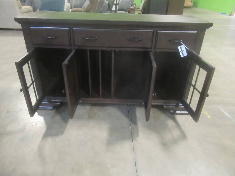 lot 317 image: CREATED FOR MACYs LEGACY CLASSIC FURNITURE Solid Wood Buffet 4 Doors (The 2 Side Glass Doors Have internal Lighting), Adjustable Shelves, 3 Doors With Velvet Inlays. Approximate Dimensions 62 x 19 x 36 Tall.