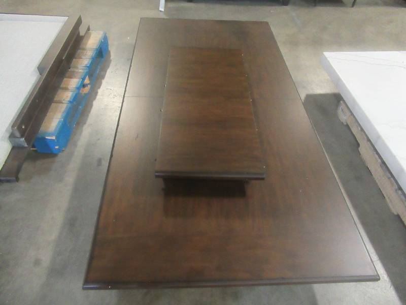 lot 329 image: CREATED FOR MACYs FURNITURE, Solid Wooden Dining Table Top (Missing Legs - Top Only) in Mohogany Finish. Slight Corner and Edge DingsScratches (see photos). Approximate Dimensions 84 X 42 Tall. Leaf is 18.