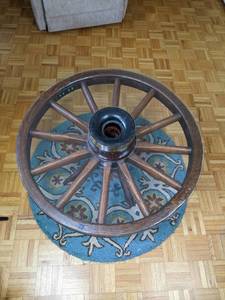 Wagon Wheel Coffee Table and Decorative Blue Throw Rug