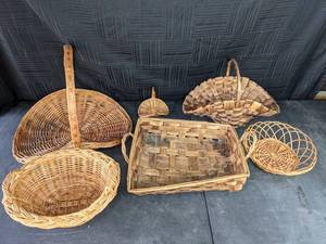 Assortment of Tan Woven Wicker Baskets with Handles and Decorative Gift Baskets