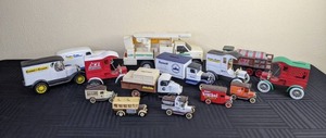 An Assortment of 14 Miniature Delivery Trucks