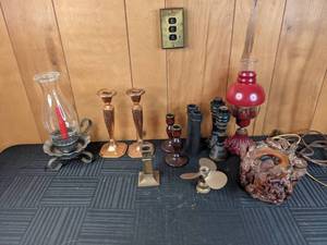 An Assortment of Candlesticks and Lamp