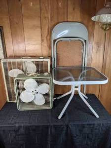 An Assortment of Fans,Table, and Chair