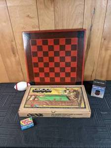 A Collection of Games Checkerboard, Canoga, Crazy Eights, and a Deluxe Dice Cup