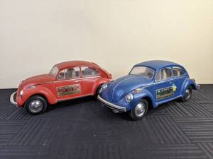 (2) Vintage 1973 Jim Beam Vokswagen Blue and Red Whiskey Decanters