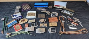Assortment of Belt Buckles, PocketFolding Knives, Bolo Ties, Long Lapel Pin, Pen Watch and More