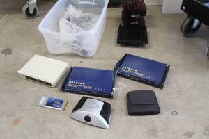 lot 410 image: Computer Equipment - Speaker Power, 6-Port Switch, Siig Port, Netgear 80211.11AB Dual Band Access Point, Linksys 5-Port Switch, Misc. Equipment