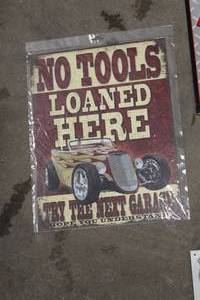 lot 552 image: No Tools Loaned Here, Try Next Door Metal Sign