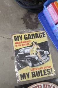 lot 556 image: My Garage My Rules - What Happens In My Garage Stays In My Garage Metal Sign