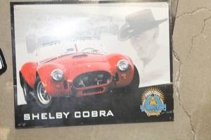 lot 600 image: Shelby Cobra 40th Anniversary Metal Sign
