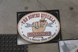 lot 617 image: The Busted Knuckle Garage Metal Sign