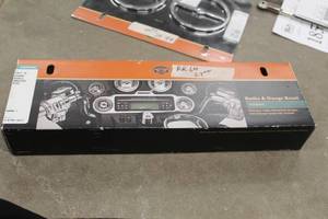 lot 636 image: Harley-Davidson 74612-06 Motorcycle Radio & Gauge Bezel Kit