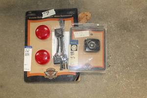 lot 666 image: Lot of (2) Harley-Davidson Motorcycle Brake Parts (NewUnopened) - Resevoir Cover, Light Module