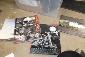 lot 704 image: Lot of (4) Motorcycle Manuals and Parts Catalog