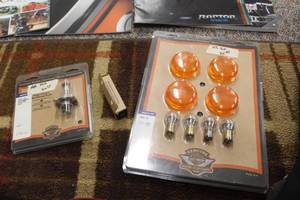 lot 758 image: Lot of (3) Motorcycle Accessories - Bullet Turn Signal Lens 69304-02, Performance Headlamp Bulb 67074-02, Spark Plug