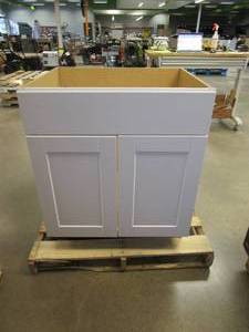 lot 780 image: HAMPTON BAY Shaker Satin White Stock Assembled Sink Base Kitchen Cabinet (30 in. x 34.5 in. x 24 in.) (BACK RIGHT HAND CORNER IS SPLIT, SEE PHOTOS)