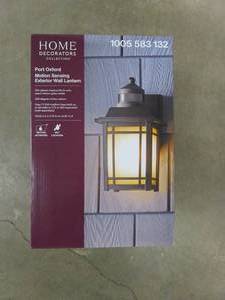 lot 756 image: HOME DECORATORS COLLECTION Port Oxford 1-Light Oil Rubbed Chestnut Motion Sensing Outdoor Wall Mount Lantern (OPEN BOX)